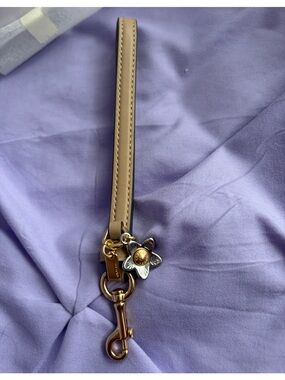Coach: Wrist Strap for Wallets, Silver/Gold Flower Charm, Color: Taupe